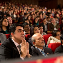 Audience members listen to the President Obama's speech on India and America at the Siri Fort Auditorium