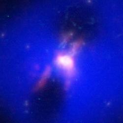 Composite image showing how powerful radio jets from the supermassive black hole inflated huge bubbles in the hot, ionized, gas surrounding the galaxy. Credit: ALMA