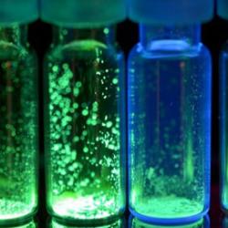 Molecules in a test tube giving off light 