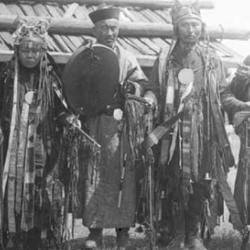 A shaman, shamaness and Achinsk Lama with helpers, June 1912. Right: A young boy with his sister, July/August 1912.