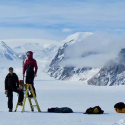 Ali Banwell and Laura Stevens installing the time-lapse camera used in this study on the George VI Ice Shelf in Antarctica. 