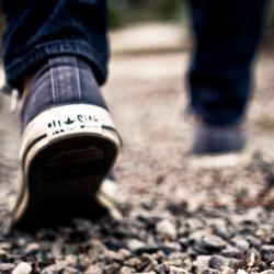 Feet walking on gravel