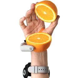 Third Thumb holding a sliced orange